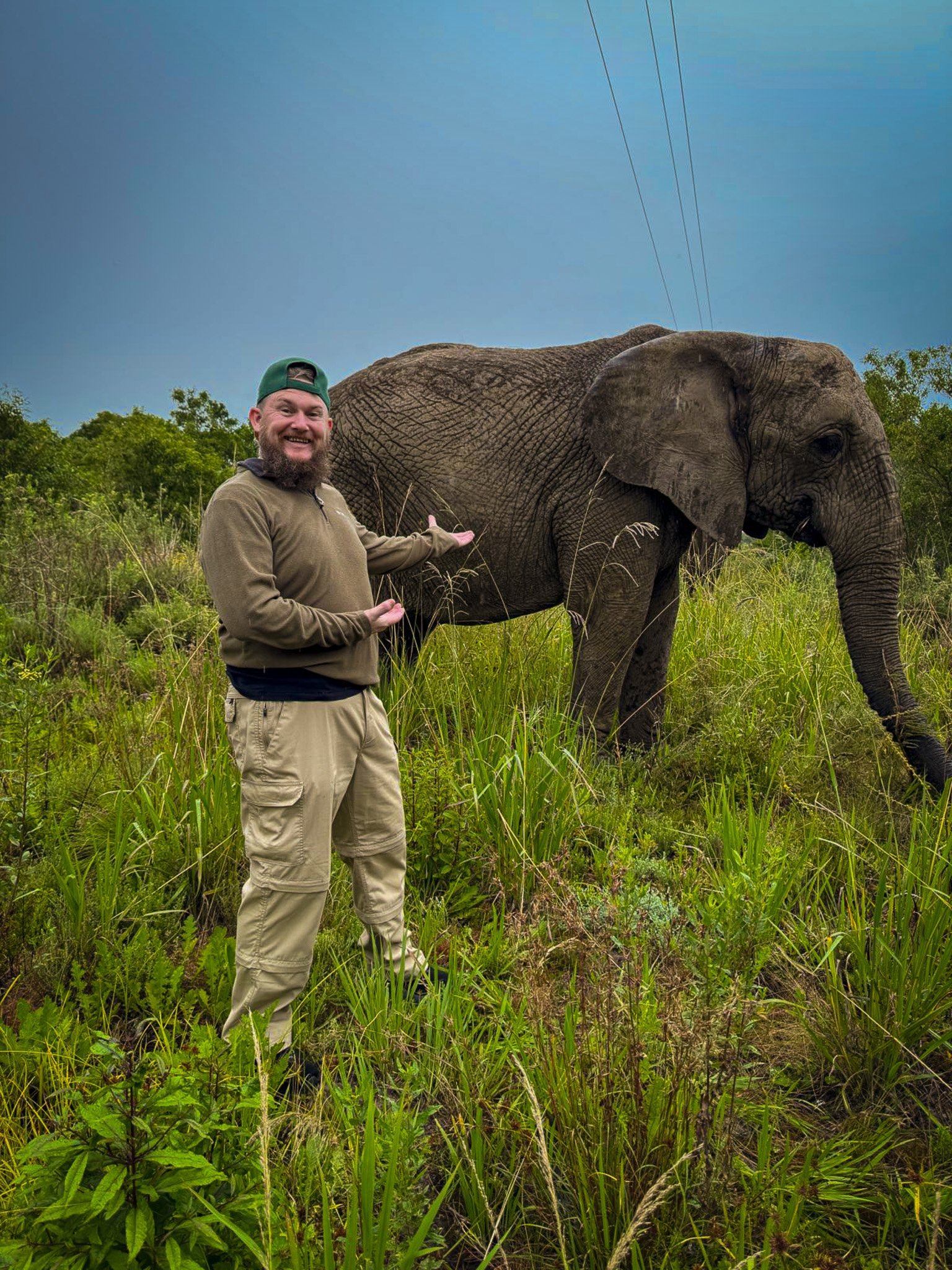 Whsipering to an Elephant at a sanctury in South Africa
